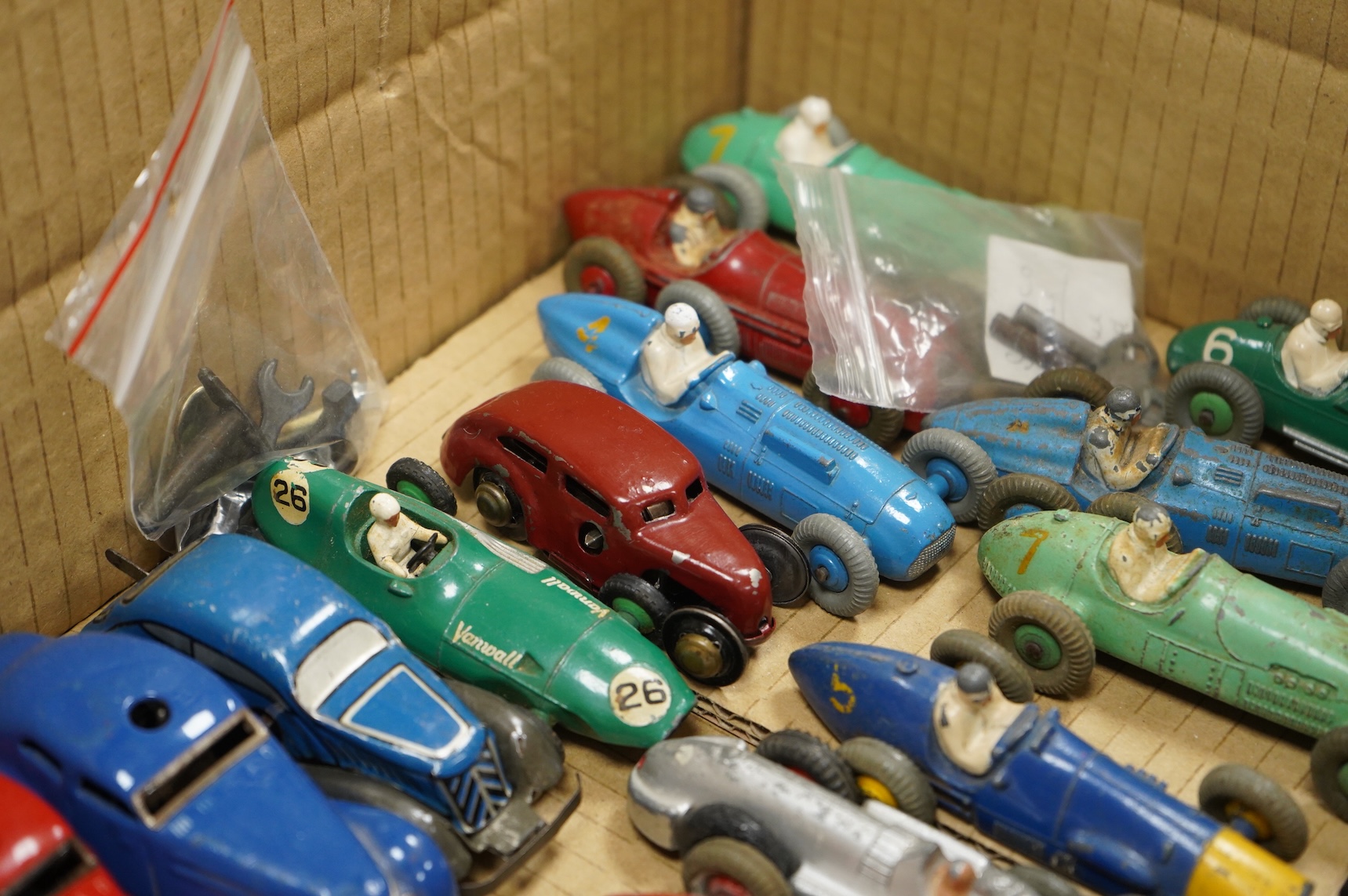 Twenty-eight diecast and tinplate vehicles by Dinky Toys, Schuco, Crescent, Corgi Toys, etc., including a good selection of single seat racing cars, three Schuco telesteering cars, etc.